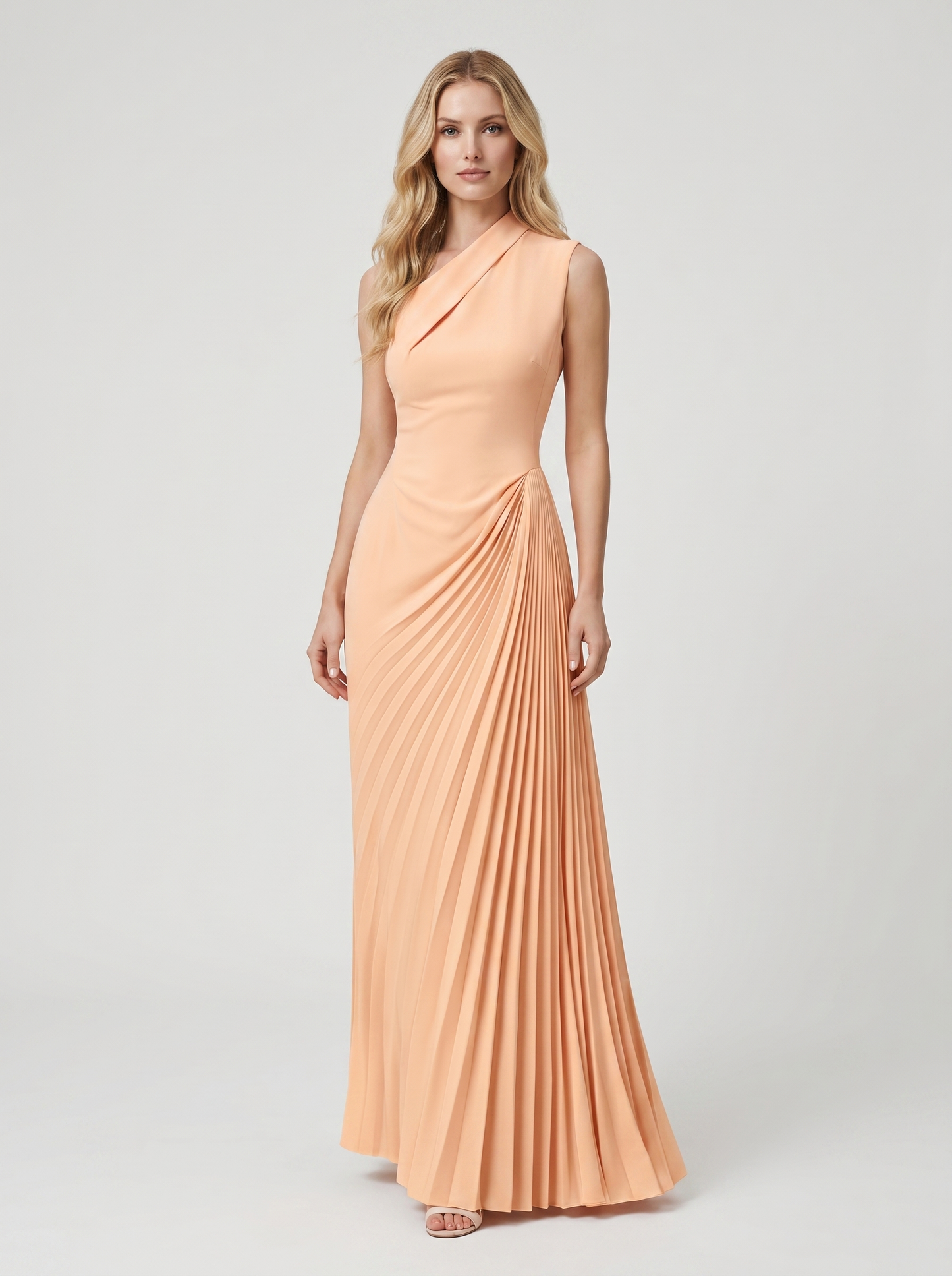 Apricot one-shoulder pleated maxi dress with fitted bodice and diagonal pleats, front view on model