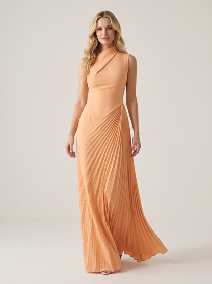 Apricot one-shoulder pleated maxi dress, full-length view of model walking in a bright studio