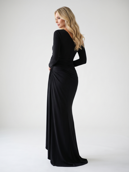 Black one-shoulder ruched maxi dress, back view showing long sleeve and full-length skirt on model