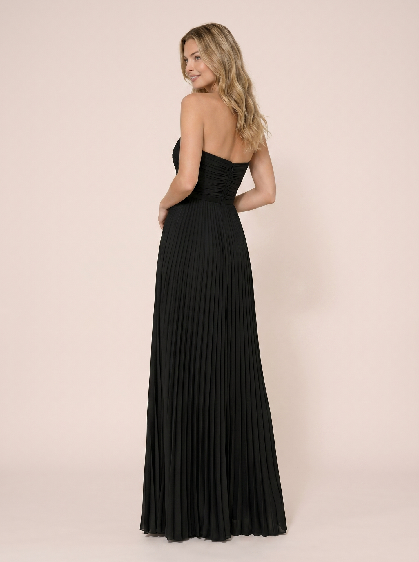 Black strapless pleated maxi dress, back view showing strapless bodice and full-length pleated skirt