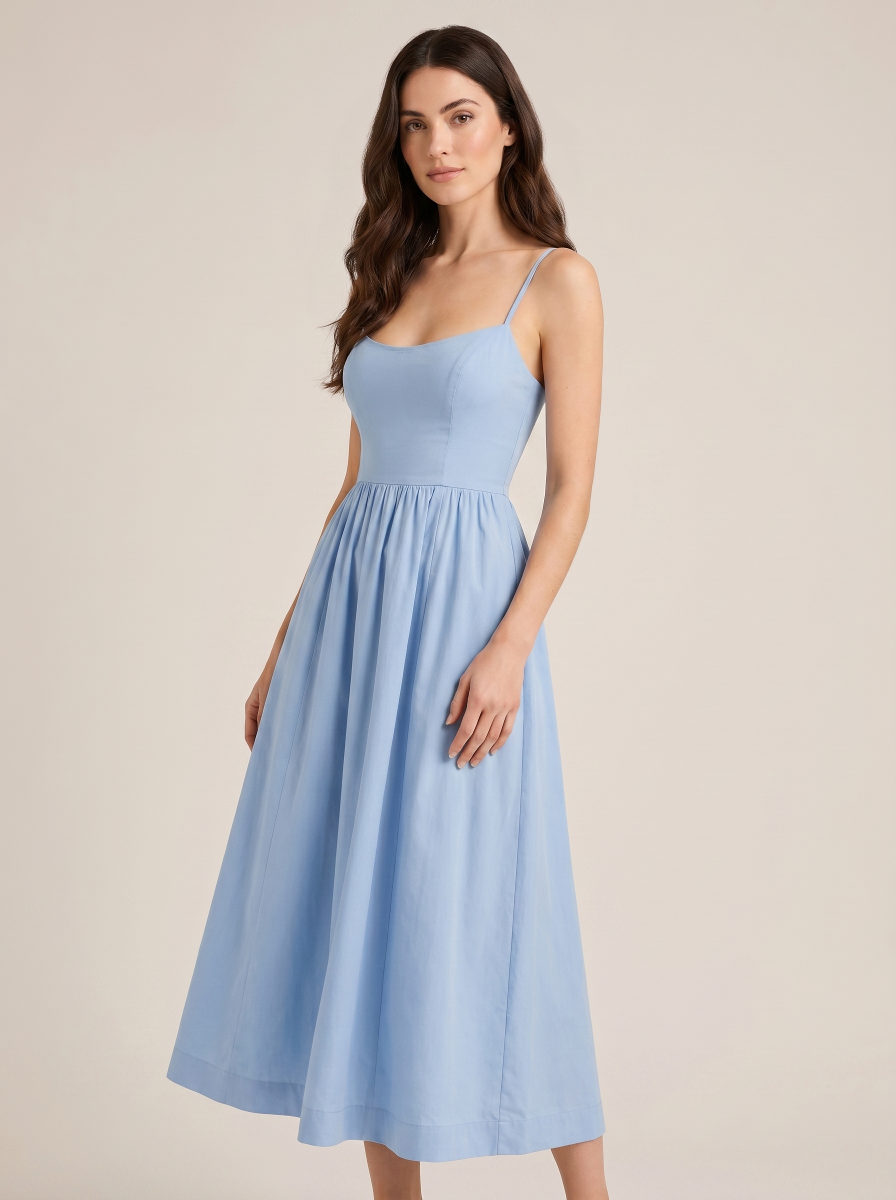 Blue A-line wedding guest midi dress, three-quarter view showing fitted waist and flared skirt