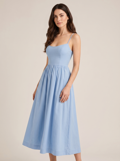 Blue A-line wedding guest midi dress, three-quarter view showing fitted waist and flared skirt