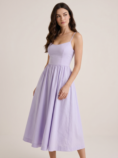Purple A-line wedding guest midi dress, three-quarter view showing fitted waist and flared skirt