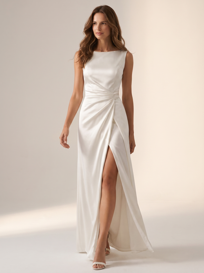 White draped satin maxi dress, full-length view of model walking in a bright studio