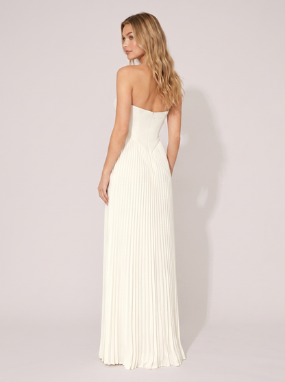 White strapless pleated maxi dress, back view showing strapless bodice and full-length pleated skirt