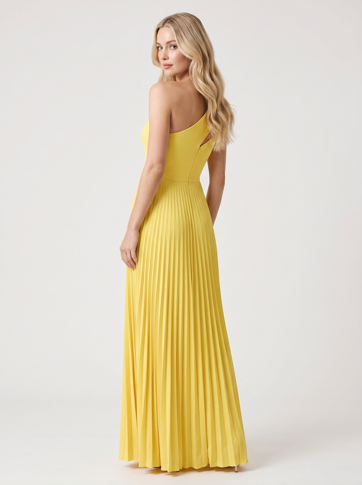 Yellow one-shoulder pleated maxi dress, back view showing bare shoulder and full-length skirt